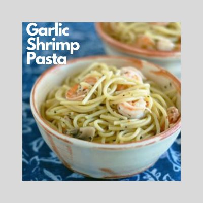 Tan bowl with spaghetti topped with garlic shrimp