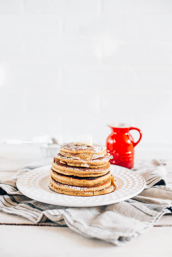 stack of pancakes on a white plate