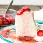 Image is a slice of angel food cake with strawberries