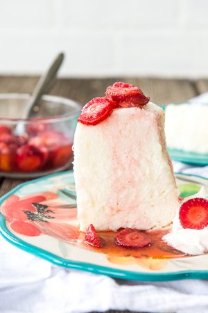 Image is a slice of angel food cake with strawberries