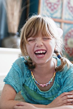 Photo of Ella age 7 lauging