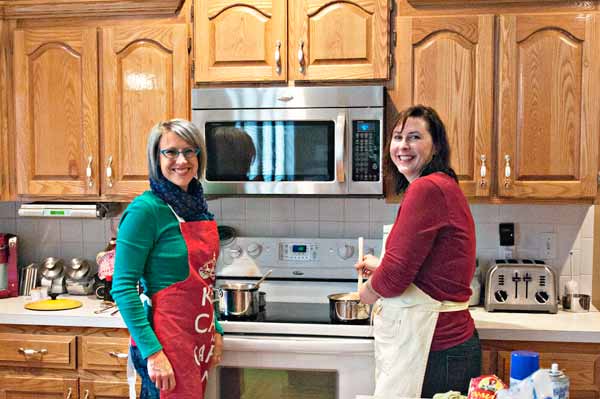 Girls-Cooking-by-Stove-Small