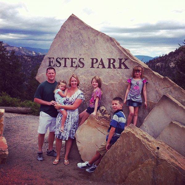 Estes Park Family photo in front of the sign
