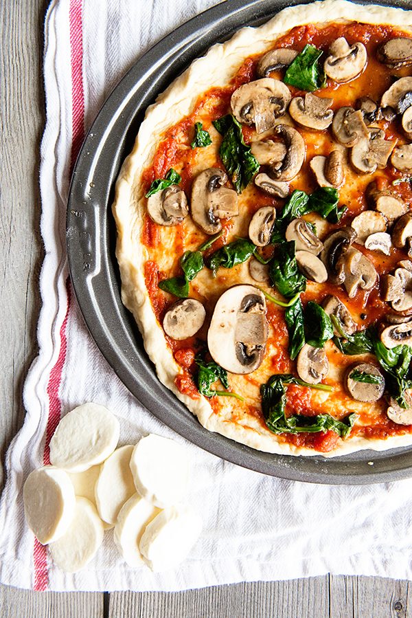 A fantastic pizza dough recipe that is ready in 30 minutes and a recipe for a Sauteed Spinach and Mushroom Pizza