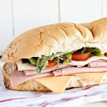 Hero Sub Sandwich recipe with super simple sauce. This is a great game day idea for a crowd! From dineanddish.net