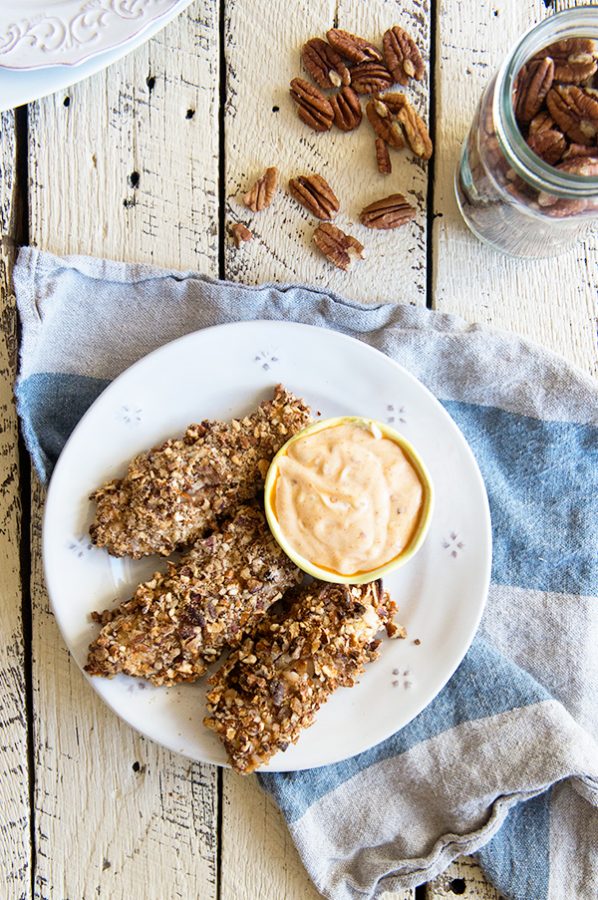 On the table in 30 minutes, these pecan and pretzel crusted baked chicken tenders are the perfect weeknight meal!