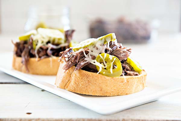 Slow Cooker Roast Beef Sandwiches are a great way to use up chuck roast and to try something new.