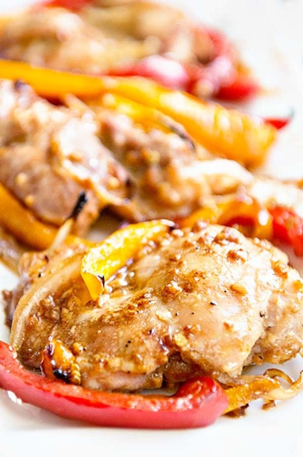 Baked Boneless Chicken Thighs with Peppers and Onions from dineanddish.net