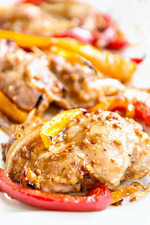 Baked Boneless Chicken Thighs with Peppers and Onions from dineanddish.net