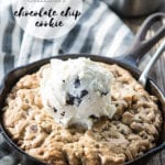 chocolate chip cookie in a cast iron skillet topped with ice cream
