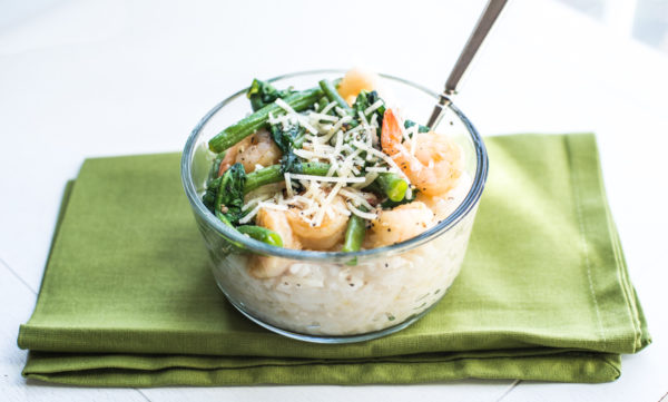 Instant Pot Risotto in a glass bowl with shrimp and veggies
