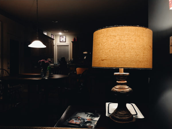A dusty lamp in a dark room