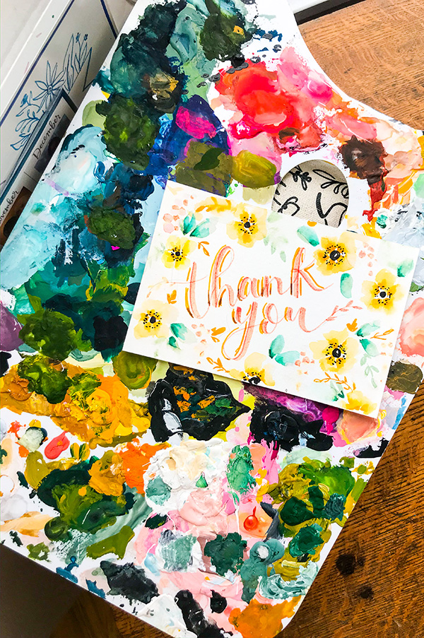 Thank you note on a watercolor paint palate