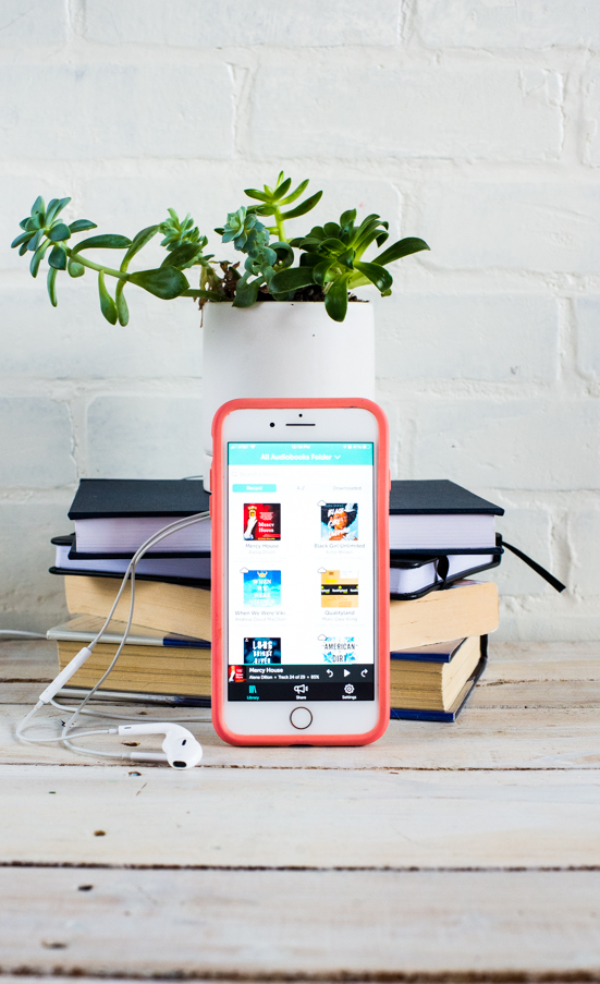 iphone cover with libro.fm list of audiobooks on a white table