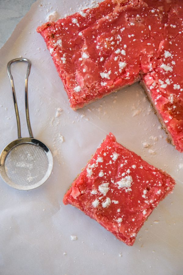 White background with strawberry jello cake mix bar cookies